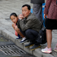 People wait for a bus in central Pyongyang, North Korea.